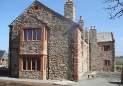 Completed bay windows, including date stone