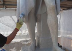 Applying a lime shelter coat to preserve the monument.