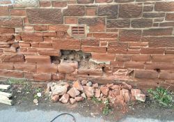 Road side house elevation: Renewal of stone walling that had been eroded by salts (BEFORE)